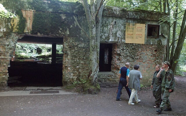 Tourists visit the ruins of Adolf Hitler's headquarters the 'Wolf's Lair' in Gierloz, northeastern Poland, July 17 2004. (AP Photo/ Czarek Sokolowski, File) Tourists visit the ruins of Adolf Hitler's headquarters the 'Wolf's Lair' in Gierloz, northeastern Poland, July 17 2004. (AP Photo/ Czarek Sokolowski, File)