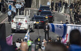 Illustrative: Protesters and security guards outside the Jerusalem District Court as the convoy carrying prime minister Benjamin Netanyahu leaves his trial at the court. (Olivier Fitoussi/Flash90)