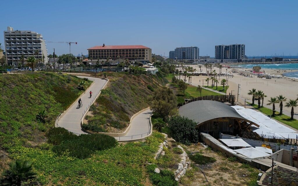 Israelis enjoy a sunny summer day at the Zvulun beach in Herzliya on June 27, 2023. (Michael Giladi/Flash90) Israelis enjoy a sunny summer day at the Zvulun beach in Herzliya on June 27, 2023. (Michael Giladi/Flash90)