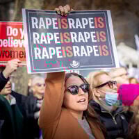 Demonstrators gather during a protest decrying sexual violence against women in the October 7 massacre, outside of United Nations headquarters in New York City, on December 4, 2023. (Yakov Binyamin/Flash90)