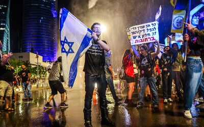 Demonstrators clash with police during a protest calling for the release of hostages held by terror groups in the Gaza Strip since October 7 and against the government near the IDF's Hakirya Base in Tel Aviv, May 11, 2024. (Itai Ron/Flash90)
