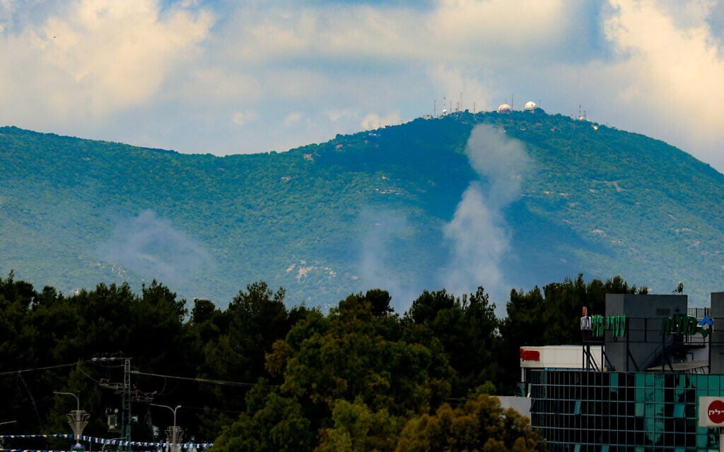 Smoke rises after rockets fired from Lebanon hit an open area in Mount Meron, northern Israel, May 15, 2024. (David Cohen/Flash90)