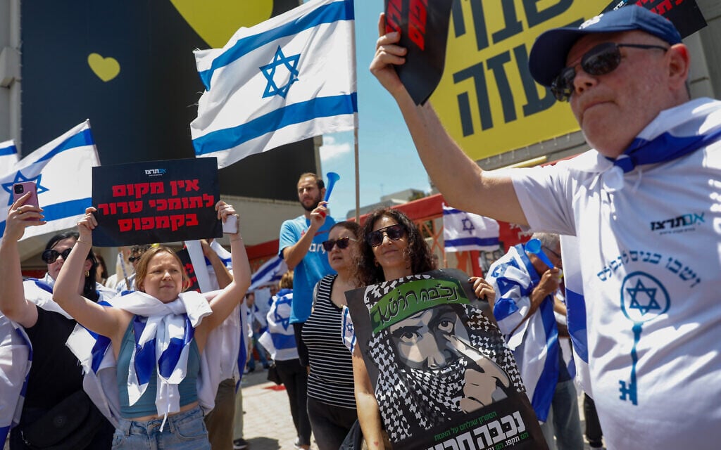 Right-wing activists from the Im Tirzu movement demonstrate in front of a rally by Arab and left-wing activist students (unseen) marking the Palestinian 'Nakba' anniversary at the Tel Aviv University on May 15, 2024. (Miriam Alster/Flash90)