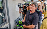 Gadi Kedem arrives to file a complaint at a police station in Tel Aviv on May 19, 2024, a day after being attacked during a demonstration. (Flash90)