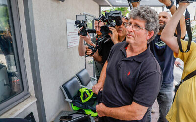 Gadi Kedem arrives to file a complaint at a police station in Tel Aviv on May 19, 2024, a day after being attacked during a demonstration. (Flash90)