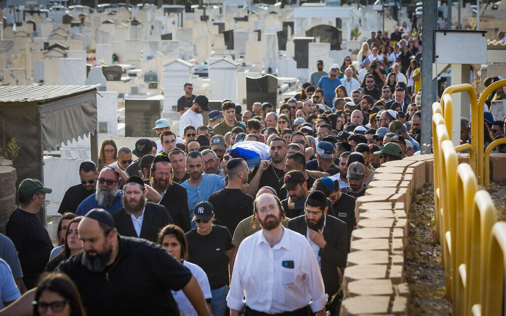 Family and friends attend the funeral of Amit Buskila in Kiryat Gat, on May 19, 2024. Buskila was murdered on October 7, 2023 by Hamas terrorists and her body was kidnapped to the Gaza Strip. (Liron Moldovan/Flash90)