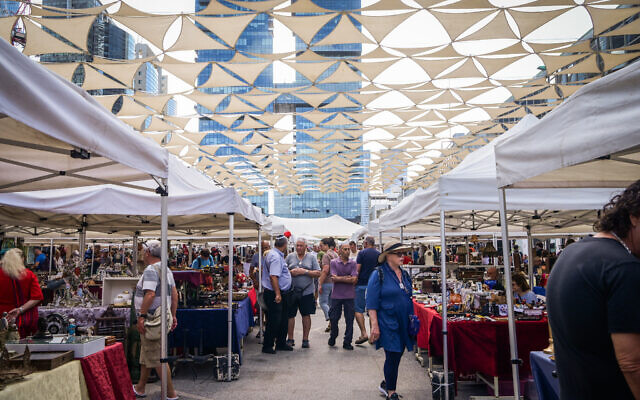 People shop at the the Vintage Market in Tel Aviv on May 24, 2024. (Avshalom Sassoni/Flash90)