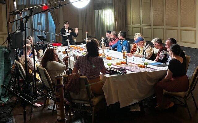Frank London, standing, works with a team of musicians at Beth El Synagogue Center in New Rochelle, New York, May 22, 2024. (Aaron Bendich via JTA)