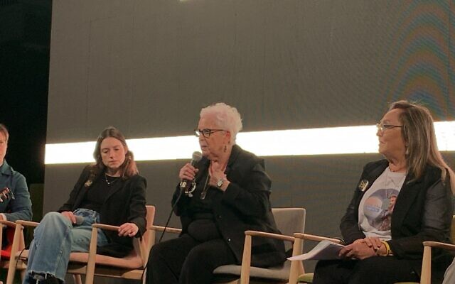 Hannah Gofrit, an 88-year-old Holocaust survivor, gives her testimony at a hostage families event in Tel Aviv's Hostages Square on the eve of Holocaust Remembrance Day, May 5, 2024. (Charlie Summers/ Times of Israel)