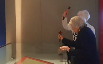 Two environmental activists attack a glass case containing an original copy of the Magna Carta at the British Library on  May 10, 2024 (Screencapture X: used in accordance with Clause 27a of the Copyright Law)