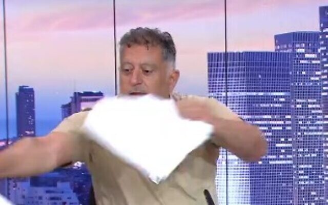 Eli Albag rips up a libel suit on Channel 12 on May 24, 2024. (Screen capture/X)