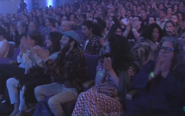 The crowd at the pre-recorded annual Joint Israeli-Palestinian Memorial ceremony, filmed May 8, 2024, and broadcast on Memorial Day eve on May 12. (Screenshot: YouTube/Combatants for Peace; used in accordance with Clause 27a of the Copyright Law) The crowd at the pre-recorded annual Joint Israeli-Palestinian Memorial ceremony, filmed May 8, 2024, and broadcast on Memorial Day eve on May 12. (Screenshot: YouTube/Combatants for Peace; used in accordance with Clause 27a of the Copyright Law)