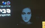 The illuminated image of Anne Frank's face projected on the walls of Tel Aviv's Habima Theater on May 1, 2024, ahead of Holocaust Remembrance Day (Courtesy)
