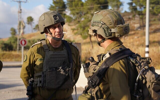 Maj. Gen. Yehuda Fox, left, at the scene of a West Bank ramming attack on May 30, 2024. (Israel Defense Forces)
