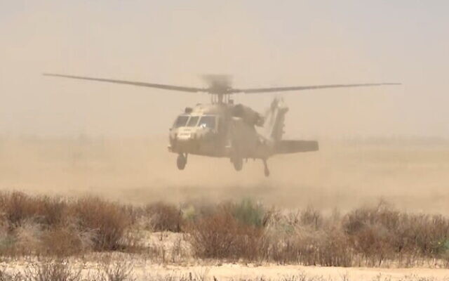 A helicopter lands in southern Israel after a number of people were wounded in a Hamas rocket attack in the Kerem Shalom area, May 5, 2024 (Screen grab via Channel 12 news used in accordance with Clause 27a of the Copyright Law)