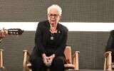 Hannah Gofrit, an 88-year-old Holocaust survivor speaks to a crowd of people in Tel Aviv's Hostages Square at Holocaust Remembrance Day event on evening of May 5, 2024. (Courtesy of Hostages and Missing Families Forum/Paulina Patimer)