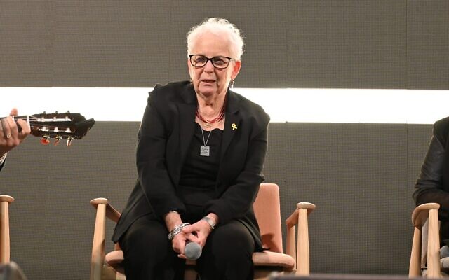 Hannah Gofrit, an 88-year-old Holocaust survivor speaks to a crowd of people in Tel Aviv's Hostages Square at Holocaust Remembrance Day event on evening of May 5, 2024. (Courtesy of Hostages and Missing Families Forum/Paulina Patimer) Hannah Gofrit, an 88-year-old Holocaust survivor speaks to a crowd of people in Tel Aviv's Hostages Square at Holocaust Remembrance Day event on evening of May 5, 2024. (Courtesy of Hostages and Missing Families Forum/Paulina Patimer)