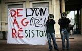 File: Demonstrators use megaphones next to a banner reading in French "From Lyon to Gaza, let's resist!" during aprotest action in the courtyard of the Institute of Political Studies (Sciences Po) building in Lyon, central Eastern France, on April 30, 2024. (Photo by OLIVIER CHASSIGNOLE / AFP)