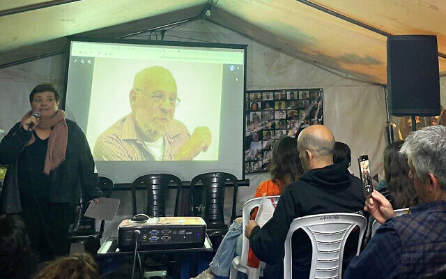 Tamar Pearlman, left, niece of Hamas hostage Alex Dancyg, speaks about her uncle's Holocaust history at a Zikaron Basalon event in Jerusalem on Holocaust Remembrance Day, May 5, 2024. (Jessica Steinberg/Times of Israel) Tamar Pearlman, left, niece of Hamas hostage Alex Dancyg, speaks about her uncle's Holocaust history at a Zikaron Basalon event in Jerusalem on Holocaust Remembrance Day, May 5, 2024. (Jessica Steinberg/Times of Israel)