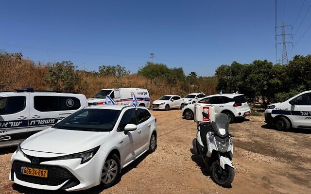 Police, ambulance and rescue vehicles at the scene where a body was found near the Morasha cemetery in Ramat Sharon in central Israel, May 16, 2024. (ZAKA)