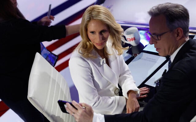 Moderators Jake Tapper (right) and Dana Bash during a commercial break of the CNN Republican Presidential Primary Debate in Sheslow Auditorium at Drake University, January 10, 2024 in Des Moines, Iowa. (Chip Somodevilla/Getty Images via JTA)