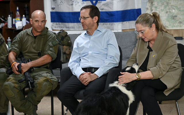 President Isaac Herzog, center, and his wife Michal, right, meet members of the security squad of Kibbutz Hanita in the north, June 25, 2024. (Maayan Toaf/GPO) President Isaac Herzog, center, and his wife Michal, right, meet members of the security squad of Kibbutz Hanita in the north, June 25, 2024. (Maayan Toaf/GPO)