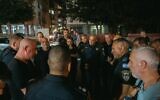 Israel Police officers from the Ayalon District Police hold an assessment at the scene of a deadly shooting in Bat Yam, June 25, 2024. (Israel Police)