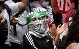Protesters wearing Hamas headbands and masks at Baruch College in Manhattan, June 5, 2024. (Luke Tress via JTA)