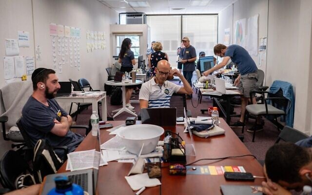 Volunteers staff the phones in the Westchester Unites office in New Rochelle, New York, June 19, 2024. (Luke Tress/JTA)