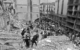 Firemen and policemen search for wounded people after a bomb exploded at the Argentinian Israelite Mutual Association (AMIA in Spanish) in Buenos Aires, Argentina, July 18, 1994. (Ali Burafi/AFP)