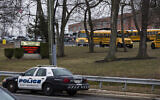 Illustrative: School buses drive from the campus of East Brunswick High School after the school day on East Brunswick, New Jersey, February 22, 2018. (DOMINICK REUTER / AFP)