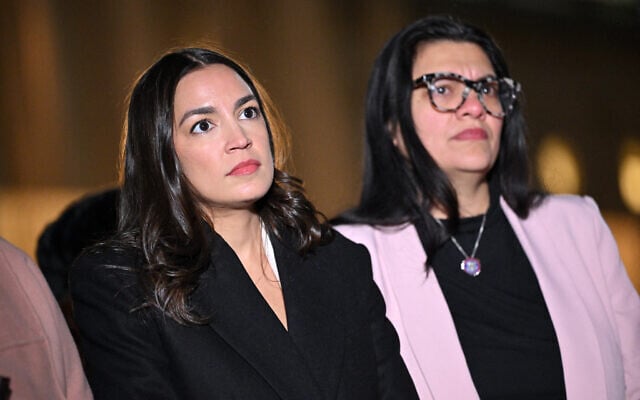 US Representative Alexandria Ocasio-Cortez (left), a New York Democrat, and US Representative Rashida Tlaib (R), a Michigan Democrat, attend a rabbis news conference calling for a ceasefire between Israel and Hamas, on Capitol Hill in Washington, DC, on November 13, 2023. (Mandel Ngan/AFP) US Representative Alexandria Ocasio-Cortez (left), a New York Democrat, and US Representative Rashida Tlaib (R), a Michigan Democrat, attend a rabbis news conference calling for a ceasefire between Israel and Hamas, on Capitol Hill in Washington, DC, on November 13, 2023. (Mandel Ngan/AFP)