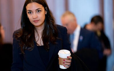 US Representative Alexandria Ocasio-Cortez (D-NY) departs after viewing graphic footage from the October 7, 2023, Hamas massacre in Israel, shown by the US House Foreign Affairs Committee, on Capitol Hill in Washington, DC, on November 14, 2023. (Stefani Reynolds/AFP)