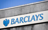 File - The Barclays Bank logo is seen on a sign outside a branch of the bank in Bracknell town center on January 10, 2024. (Adrian Dennis/AFP)