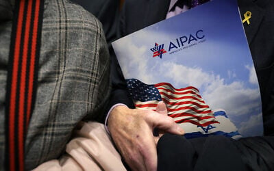 Illustrative: A visitor to the US Capitol, wearing a yellow ribbon to raise awareness for hostages held by Hamas in Gaza, clutches an AIPAC folder while taking the elevator in the Rayburn House Office Building, in Washington, DC, March 12, 2024. (Alex Wong / Getty Images North America / Getty Images via AFP) Illustrative: A visitor to the US Capitol, wearing a yellow ribbon to raise awareness for hostages held by Hamas in Gaza, clutches an AIPAC folder while taking the elevator in the Rayburn House Office Building, in Washington, DC, March 12, 2024. (Alex Wong / Getty Images North America / Getty Images via AFP)