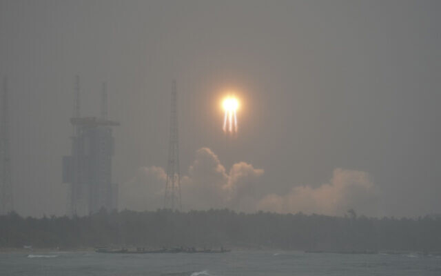 A Long March 5 rocket, carrying the Chang'e-6 mission lunar probe, lifts off as it rains at the Wenchang Space Launch Centre in southern China's Hainan Province on May 3, 2024. (AFP) A Long March 5 rocket, carrying the Chang'e-6 mission lunar probe, lifts off as it rains at the Wenchang Space Launch Centre in southern China's Hainan Province on May 3, 2024. (AFP)
