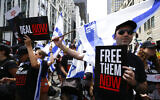 People march on Fifth Avenue to demand the release of the hostages held by Hamas in Gaza as they participate in the annual Israel Day Parade on June 2, 2024 in New York City. (John Lamparski / AFP)