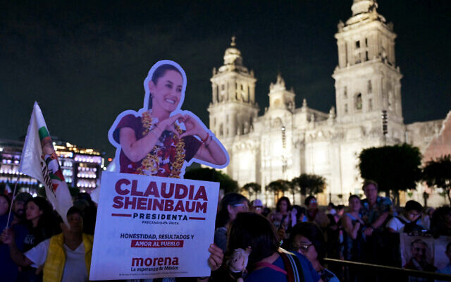 Supporters of Mexico's presidential candidate for the Morena party, Claudia Sheinbaum wait for her at Zocalo Square on election day in Mexico City on June 2, 2024 after  exit polls showed her heading to victory (Photo by YURI CORTEZ / AFP)