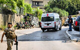 An ambulance is pictured as Lebanese army deploy near the US embassy in Beirut on June 5, 2024, after a Syrian man was arrested following a shooting near the embassy. (JOSEPH EID / AFP)