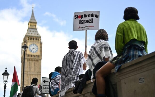 Anti-Israel protesters hold placards as they gather in front of Elizabeth Tower, commonly known by the name of the clock's bell 'Big Ben' at the Palace of Westminster, home to the Houses of Parliament, central London, on June 8, 2024 at the end of National March for Gaza. (Justin Tallis/AFP)