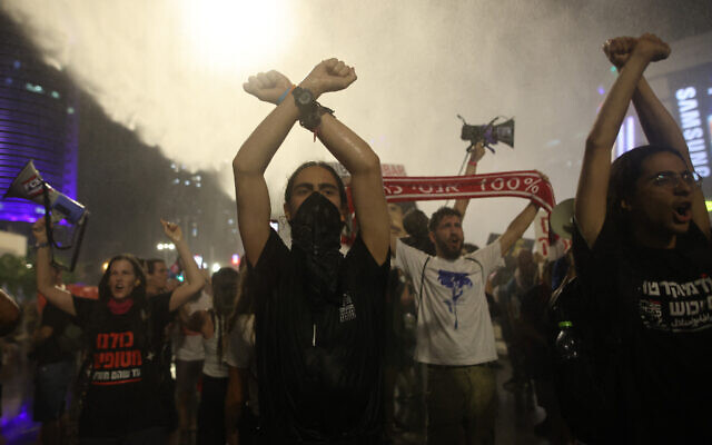 Police use a water cannon to disperse protesters calling for the release of hostages held by Hamas in Gaza, Tel Aviv, June 8, 2024. (Gil Cohen-Magen/AFP)