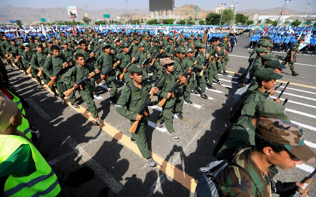 Yemeni youths take part in a parade in support of the Iran-backed Houthi rebels on June 9, 2024. (Mohammed Huwais/AFP) Yemeni youths take part in a parade in support of the Iran-backed Houthi rebels on June 9, 2024. (Mohammed Huwais/AFP)