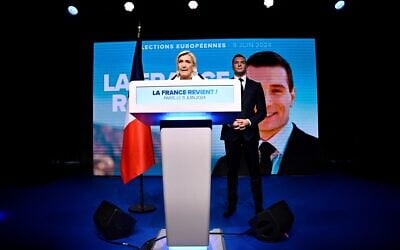 French National Rally party leader Marine Le Pen (L) speaks, flanked by party President Jordan Bardella, after French President Emmanuel Macron announced snap legislative elections, at the Pavillon Chesnaie du Roy in Paris, June 9, 2024. (Julien De Rosa/AFP)