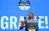 Italy's Prime Minister and leader of the far-right party Brothers of Italy (Fratelli D'Italia - FDI) Giorgia Meloni holds flowers during a press conference following the results of the European Elections in Rome on June 10, 2024.(Filippo Monteforte/AFP)