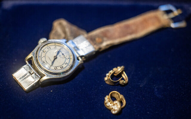 A wristwatch and a pair of earrings belonging to deceased Stanislawa Mordes are seen on June 11, 2024, in Warsaw, during a ceremony of returning the personal effects to the families of two Polish victims killed following the Warsaw Uprising from 1944. (Wojtek Radwanski/AFP) A wristwatch and a pair of earrings belonging to deceased Stanislawa Mordes are seen on June 11, 2024, in Warsaw, during a ceremony of returning the personal effects to the families of two Polish victims killed following the Warsaw Uprising from 1944. (Wojtek Radwanski/AFP)