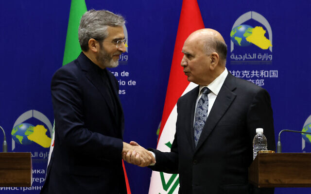 Iraqi Foreign Minister Fuad Hussein (R) and Iran's Acting Foreign Minister Ali Bagheri Kani shake hands during a joint press conference in Baghdad, on June 13, 2024. (Ahmad Al-Rubaye/AFP) Iraqi Foreign Minister Fuad Hussein (R) and Iran's Acting Foreign Minister Ali Bagheri Kani shake hands during a joint press conference in Baghdad, on June 13, 2024. (Ahmad Al-Rubaye/AFP)