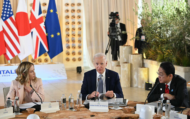 US President Joe Biden (C), Italy's Prime Minister Giorgia Meloni and Japanese Prime Minister Fumio Kishida attend a meeting at the G7 Summit in Savelletri, Italy, June 13, 2024. (Mandel Ngan/AFP) US President Joe Biden (C), Italy's Prime Minister Giorgia Meloni and Japanese Prime Minister Fumio Kishida attend a meeting at the G7 Summit in Savelletri, Italy, June 13, 2024. (Mandel Ngan/AFP)