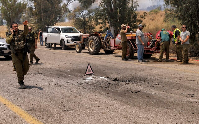 IDF soldiers deploy along a road near the site where rockets fired by terrorists in south Lebanon landed near Kfar Szold in the Upper Galilee in northern Israel on June 14, 2024. (Jalaa Marey/AFP)