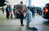 Johan Floderus kneels down and proposes to his boyfriend at Arlanda airport near Stockholm, Sweden, June 15, 2024. (Tom Samuelsson/Regeringskansliet via AFP)