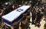 Soldiers carry the coffin of Sgt. First Class (res.) Omer Smadga, 25, who was killed the day before in a mortar strike in central Gaza, at the military cemetery in Netanya, June 21, 2024. (Jack Guez / AFP)